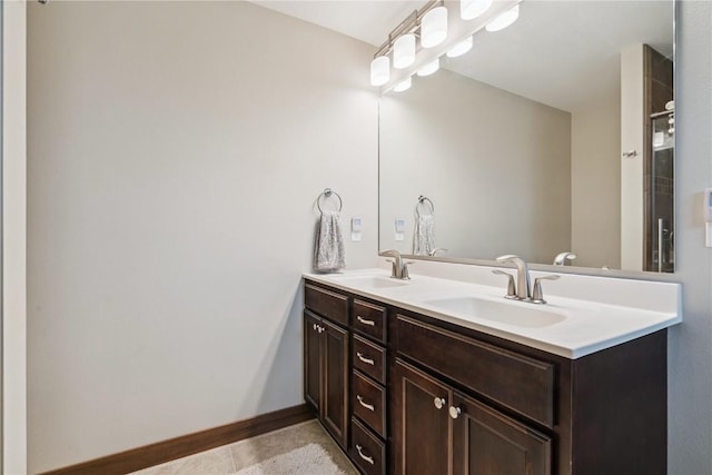 8313 Monterey Dr NE, Cedar Rapids, IA 52402 - bathroom with double vanity and tile patterned floors