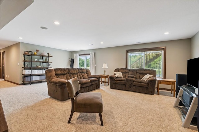 8313 Monterey Dr NE, Cedar Rapids, IA 52402 - living area with light carpet and recessed lighting
