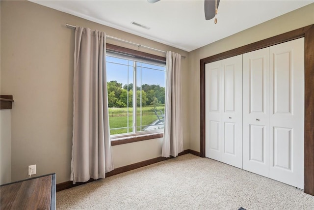 8313 Monterey Dr NE, Cedar Rapids, IA 52402 - unfurnished bedroom with a closet and ceiling fan