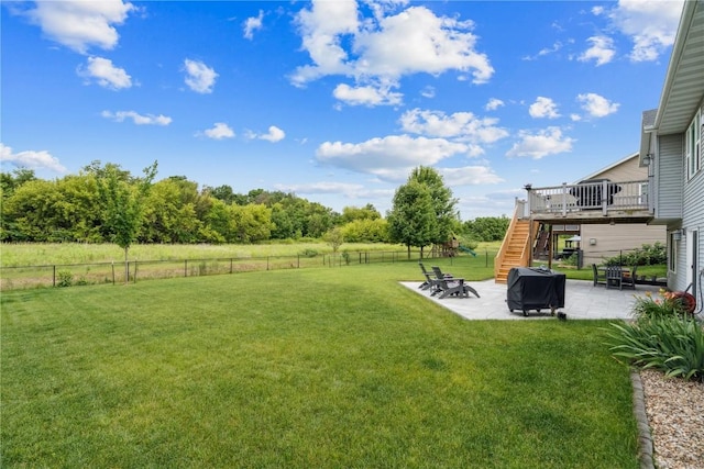 8313 Monterey Dr NE, Cedar Rapids, IA 52402 - fenced backyard with stairs, a patio area, and a wooden deck