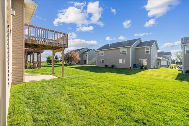 1810 Goose Lake Cir, North Liberty, IA 52317 - view of grassy yard with a deck, a residential view, and a patio