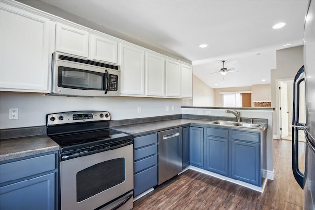 1810 Goose Lake Cir, North Liberty, IA 52317 - kitchen with appliances with stainless steel finishes, blue cabinetry, a ceiling fan, and white cabinetry