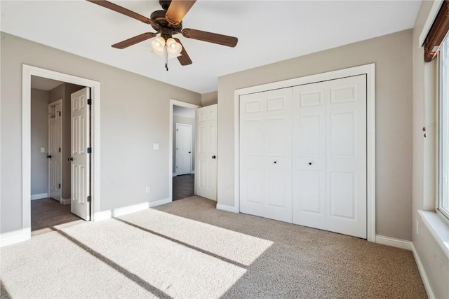 1810 Goose Lake Cir, North Liberty, IA 52317 - unfurnished bedroom with light colored carpet, a closet, and a ceiling fan