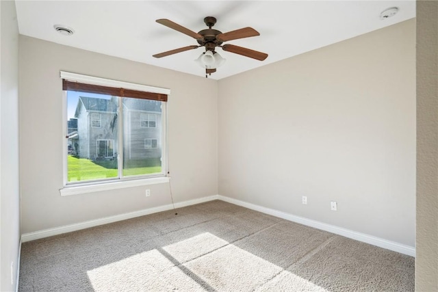 1810 Goose Lake Cir, North Liberty, IA 52317 - carpeted spare room with plenty of natural light, a smoke detector, and ceiling fan
