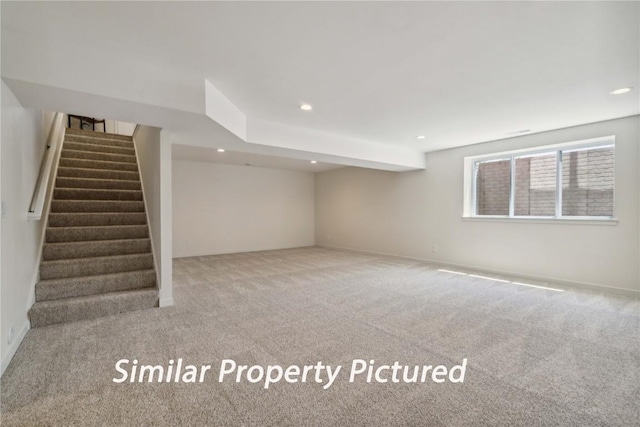 4620 Preston Ln, Iowa City, IA 52246 - basement with carpet flooring, stairway, and recessed lighting