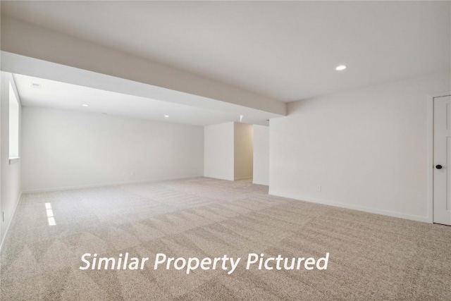 4620 Preston Ln, Iowa City, IA 52246 - unfurnished living room with light colored carpet and recessed lighting