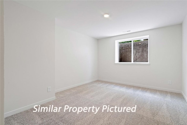 4620 Preston Ln, Iowa City, IA 52246 - carpeted spare room featuring baseboards