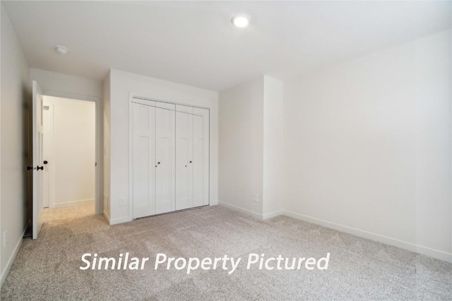4620 Preston Ln, Iowa City, IA 52246 - unfurnished bedroom featuring carpet flooring and a closet