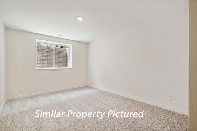 4620 Preston Ln, Iowa City, IA 52246 - carpeted empty room with baseboards