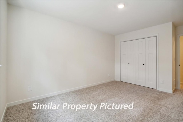 4620 Preston Ln, Iowa City, IA 52246 - unfurnished bedroom with carpet and a closet