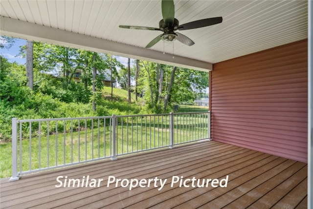 4620 Preston Ln, Iowa City, IA 52246 - wooden deck with ceiling fan and a lawn