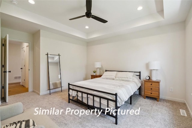 4620 Preston Ln, Iowa City, IA 52246 - bedroom with carpet, recessed lighting, a tray ceiling, and a ceiling fan