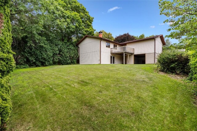 1131 Penkridge Dr, Iowa City, IA 52246 - view of grassy yard with a wooden deck