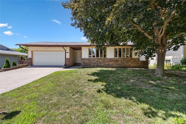 1131 Penkridge Dr, Iowa City, IA 52246 - single story home featuring brick siding, an attached garage, concrete driveway, and a front lawn