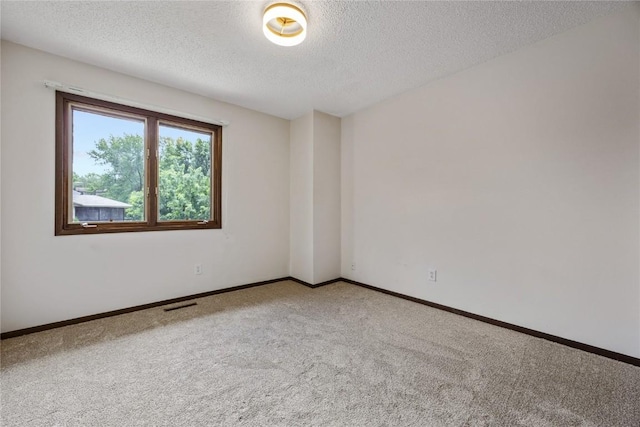 1131 Penkridge Dr, Iowa City, IA 52246 - carpeted spare room with a textured ceiling and baseboards