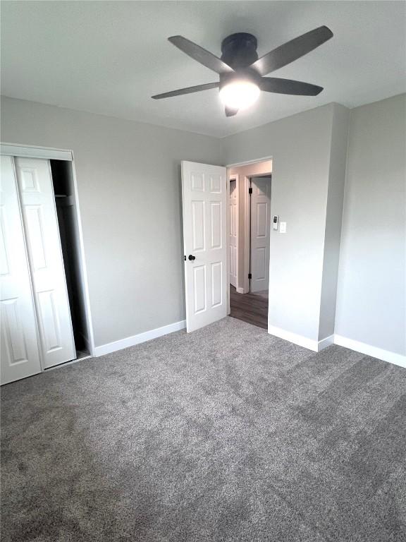 1705 NE Texas Ave, Cedar Rapids, IA 52402 - unfurnished bedroom with carpet floors, a closet, and ceiling fan
