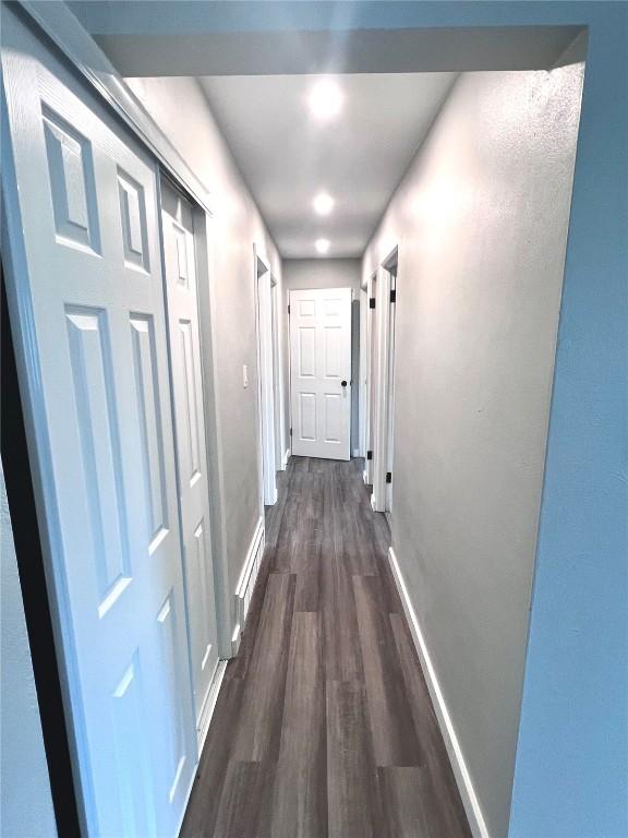 1705 NE Texas Ave, Cedar Rapids, IA 52402 - corridor with dark wood-type flooring and baseboards
