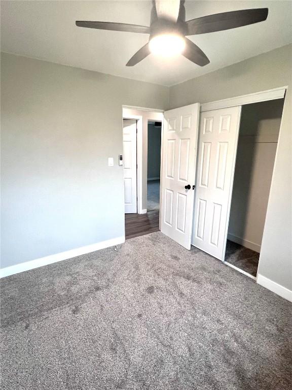 1705 NE Texas Ave, Cedar Rapids, IA 52402 - unfurnished bedroom with carpet flooring, a closet, and ceiling fan