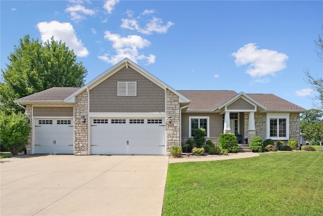 5512 Black Oak Dr NE, Cedar Rapids, IA 52411 - craftsman house with stone siding, driveway, a front lawn, and a garage