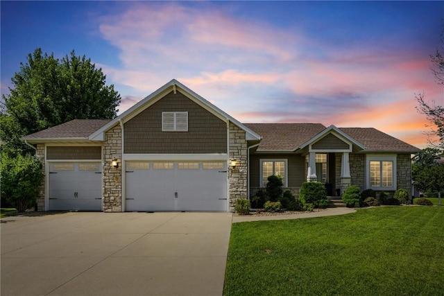 5512 Black Oak Dr NE, Cedar Rapids, IA 52411 - craftsman house featuring stone siding, concrete driveway, a front yard, roof with shingles, and a garage