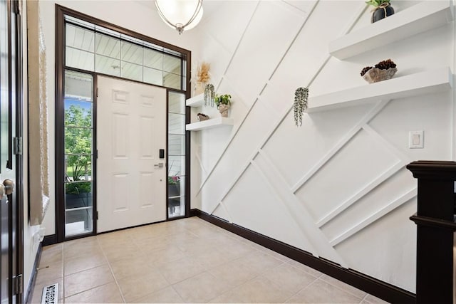 5512 Black Oak Dr NE, Cedar Rapids, IA 52411 - foyer entrance with light tile patterned floors and stairs