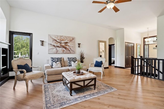 5512 Black Oak Dr NE, Cedar Rapids, IA 52411 - living room with a ceiling fan, light wood-style floors, and arched walkways