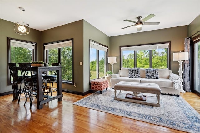 5512 Black Oak Dr NE, Cedar Rapids, IA 52411 - living room with healthy amount of natural light, a ceiling fan, and wood finished floors