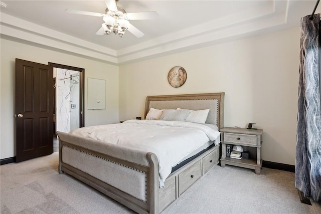 5512 Black Oak Dr NE, Cedar Rapids, IA 52411 - bedroom featuring light colored carpet, a tray ceiling, and ceiling fan