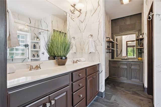 5512 Black Oak Dr NE, Cedar Rapids, IA 52411 - full bathroom featuring double vanity, tile walls, and marble finish floors