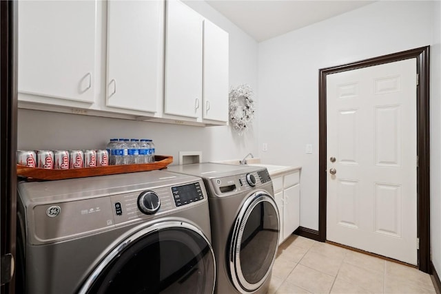 5512 Black Oak Dr NE, Cedar Rapids, IA 52411 - laundry area with separate washer and dryer, light tile patterned floors, and cabinet space