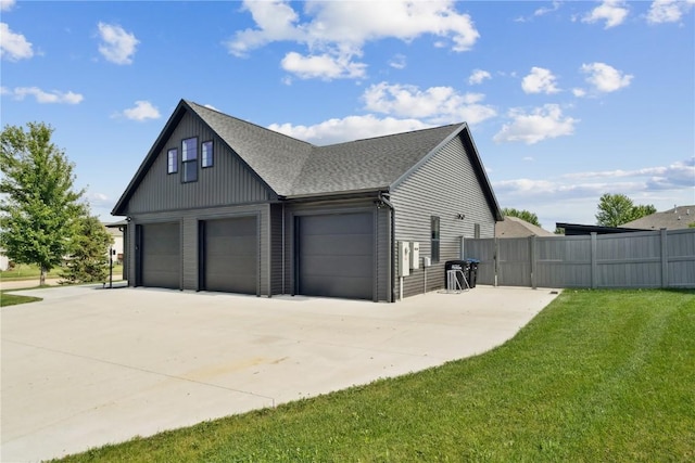 4395 Rec Dr, Marion, IA 52302 - view of side of property featuring driveway, roof with shingles, and an attached garage