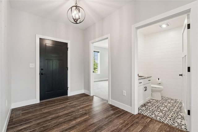 4395 Rec Dr, Marion, IA 52302 - foyer entrance featuring dark wood-style flooring and a chandelier