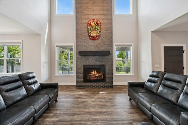 4395 Rec Dr, Marion, IA 52302 - living room with a towering ceiling, dark wood finished floors, and a brick fireplace