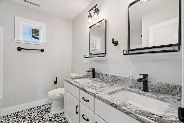 4395 Rec Dr, Marion, IA 52302 - full bath featuring double vanity, healthy amount of natural light, and tile patterned flooring