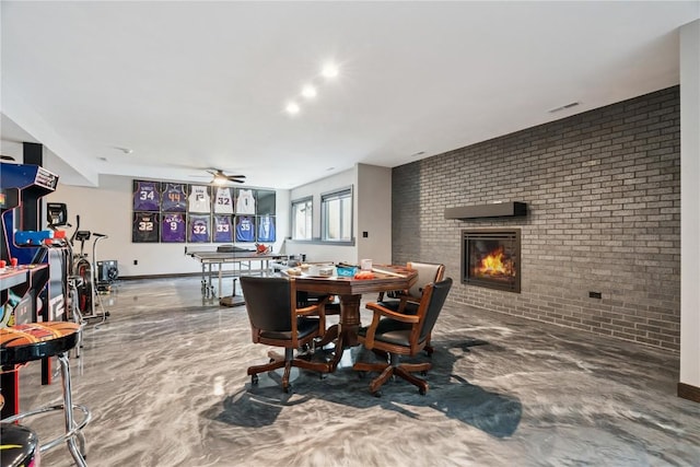 4395 Rec Dr, Marion, IA 52302 - dining room with brick wall, a fireplace, and a ceiling fan