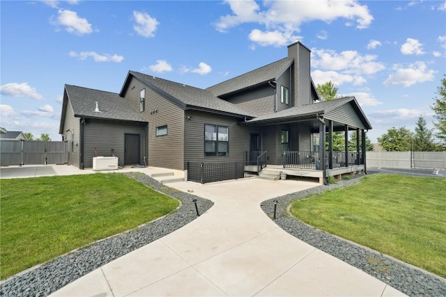 4395 Rec Dr, Marion, IA 52302 - back of property with a chimney, a gate, roof with shingles, and covered porch