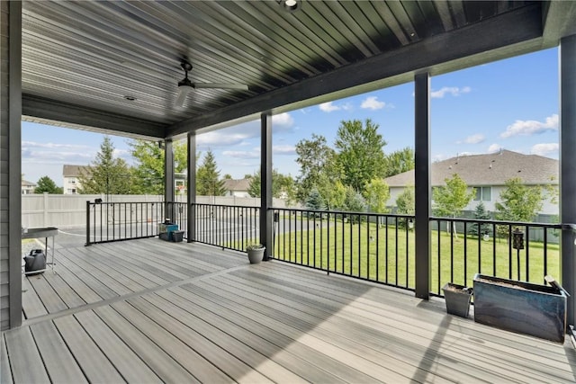 4395 Rec Dr, Marion, IA 52302 - wooden terrace with a lawn, a ceiling fan, and a residential view