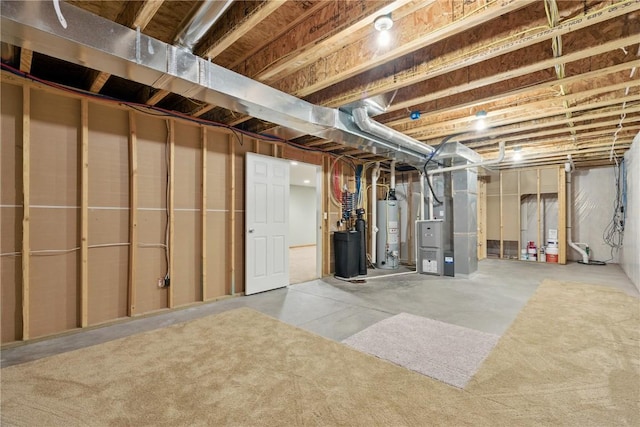 247 Kelso Ln, Fairfax, IA 5228 - unfinished basement featuring gas water heater, heating unit, and a water softener system