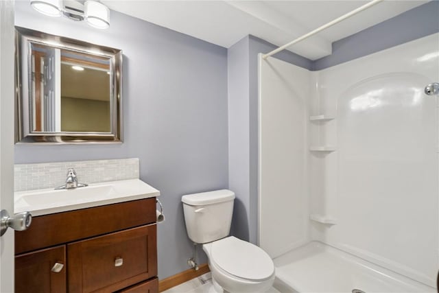 247 Kelso Ln, Fairfax, IA 5228 - bathroom with a shower, vanity, and tasteful backsplash