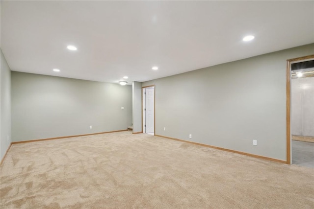 247 Kelso Ln, Fairfax, IA 5228 - finished below grade area with recessed lighting and light carpet