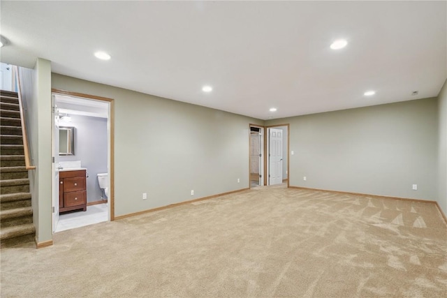 247 Kelso Ln, Fairfax, IA 5228 - unfurnished room featuring stairway, light carpet, and recessed lighting