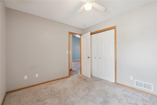 247 Kelso Ln, Fairfax, IA 5228 - unfurnished bedroom with carpet floors, a closet, and ceiling fan