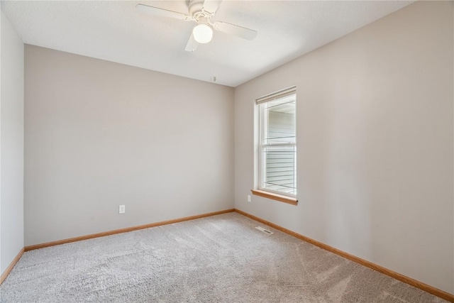 247 Kelso Ln, Fairfax, IA 5228 - empty room with carpet floors and a ceiling fan