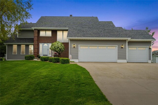 4199 Brookside Dr, Marion, IA 52302 - view of front of home with concrete driveway, an attached garage, a front yard, and roof with shingles