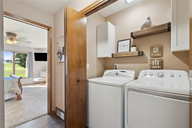 4199 Brookside Dr, Marion, IA 52302 - laundry room featuring cabinet space, separate washer and dryer, dark wood-style floors, and a ceiling fan