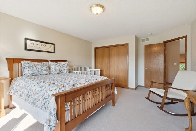4199 Brookside Dr, Marion, IA 52302 - bedroom with light colored carpet and a closet