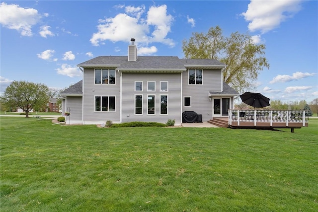4199 Brookside Dr, Marion, IA 52302 - rear view of house featuring a wooden deck, a yard, and a chimney