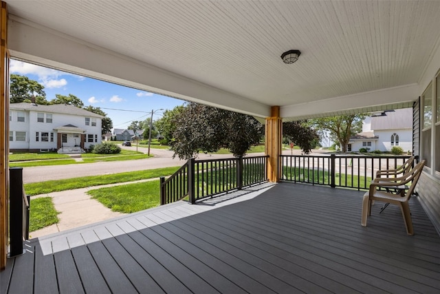 308 Main St, Norway, IA 52318 - wooden porch featuring a yard and a residential view