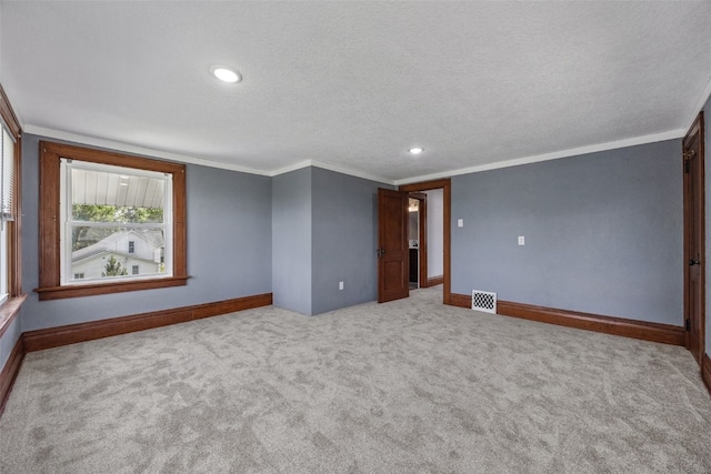308 Main St, Norway, IA 52318 - spare room featuring ornamental molding, carpet floors, recessed lighting, and a textured ceiling