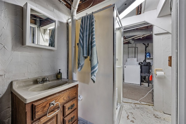 107 Spruce St, Blairstown, IA 52209 - bathroom with washer / dryer and vanity